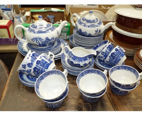 A quantity of Woods Ware "Willow" pattern tea ware including two teapots/ 12 teacups, cream jug, 12 saucers etc.