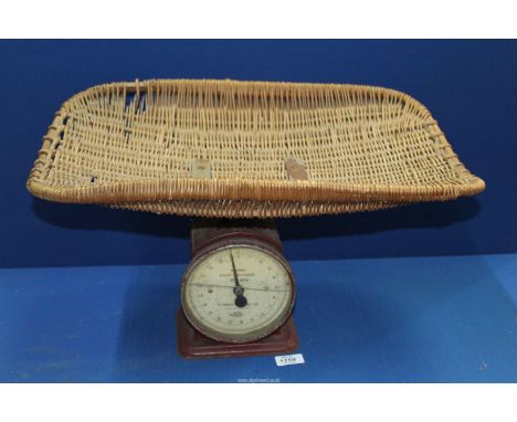 A vintage Hughes, Salters baby weighing Scales with rattan basket.