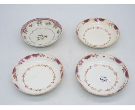 Three old Crown Derby saucers (one with crack) and another with fish scales with floral detail.