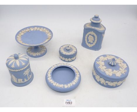 A small quantity of pale Wedgwood Jasperware including footed comport with grapevine, lidded caddy, lidded pots etc.