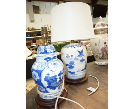 An oriental style lamp and shade and a smaller one with no shade.