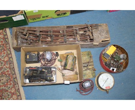 A box of model railway items including two of "O" gauge level crossings, a tinplate tunnel, an electric railway controller (f