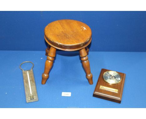 An early 20th century four leg milking Stool, 9" high, a barometer and a brass cooking thermometer.