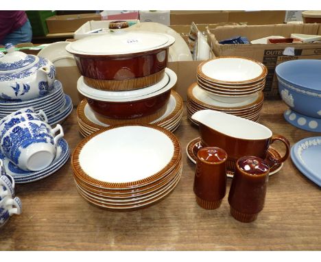A quantity of Poole dinnerware including two lidded tureens, six dinner plates, salt and pepper pots, gravy boat and saucer, 