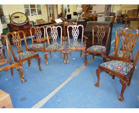 A set of eight Chippendale style Dining Chairs including a pair of carver chairs having drop-in seats with blue ground stylis
