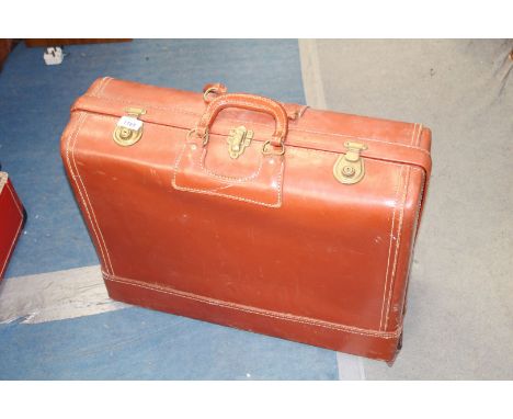 A Vintage leather suitcase, by Kam Lung Leather wares, Kowloon, Hong Kong, (handles broken)