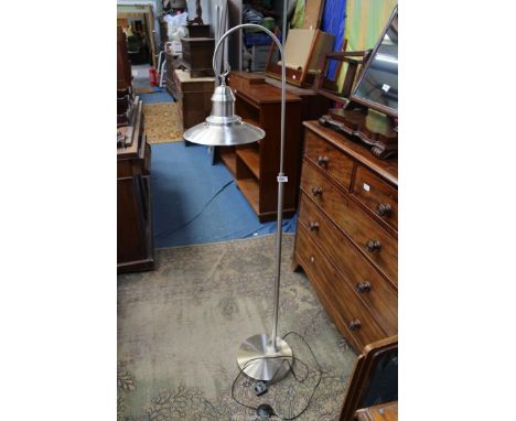 A contemporary, floor standing industrial style Lamp.