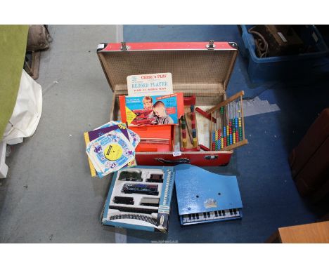 A red case containing vintage children's toys to include "Pixiano", Chad Valley record player, an abacus, etc. and a H.O. Pla