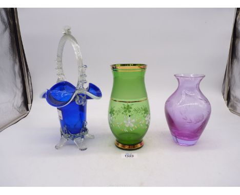 A large Caithness baluster glass vase 7 1/1" tall, a Bristol blue and clear glass ornate basket 12" tall and a green Bohemia 