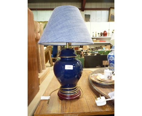 A single Wade dark blue pottery lamp with shade, 19 1/2" tall including shade.