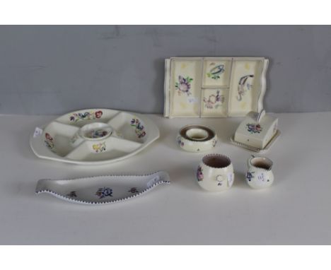 A selection of Poole Pottery, comprising hors d'oeuvre dish, sectional serving dish, sandwich plate, butter dish and cover, p