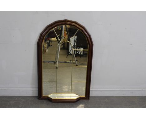 A modern mahogany and gilt effect arched top mirror with lead'-glazed effect and base shelf 107cm x 66cm