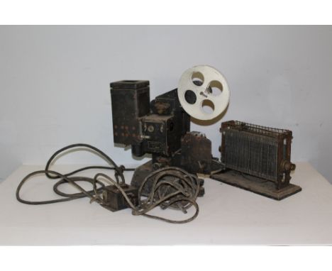 An Eastman Kodak Company Kodascope projector, with photo switch and two movie reels Charlie Chaplin 'Champion Charlie' No1 &a