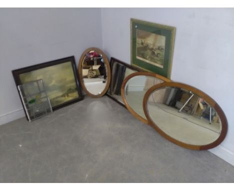 A group of four mirrors, three oval and one rectangular, together with a steeple chase scene print, coastal scene print and a