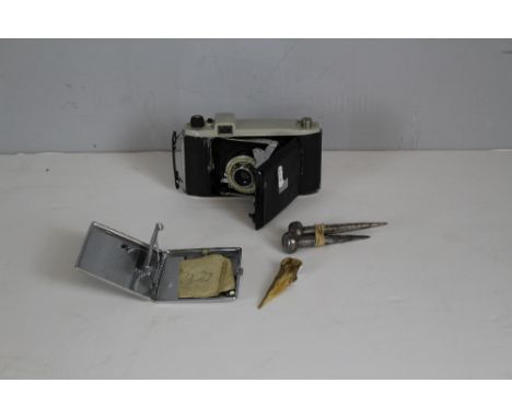 A Kodak Kodette III camera, a chrome cigarette case, carved bone skewer and two metal plumb weights