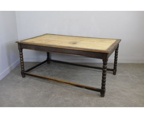 A large Victorian pine and oak table, with bobbin-turned supports linked by plain stretchers 77cm x 183cm x 95cm AF one end s