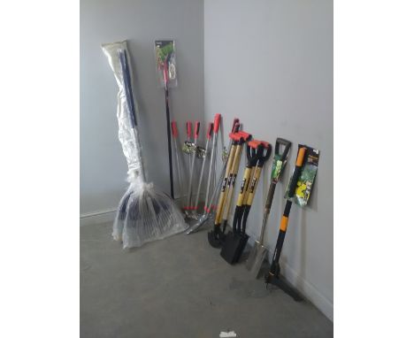 A quantity of garden tools, long handled edging shears, long handled lawn shears, edging knives, ash handled spades, border s