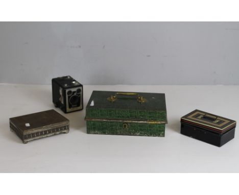 A box Brownie model D camera, a small cash box, a larger painted cash box with sectioned interior and a tin box.