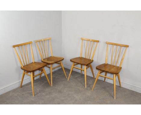 A set of four 1960's light Ercol stick back kitchen chairs 78cm high