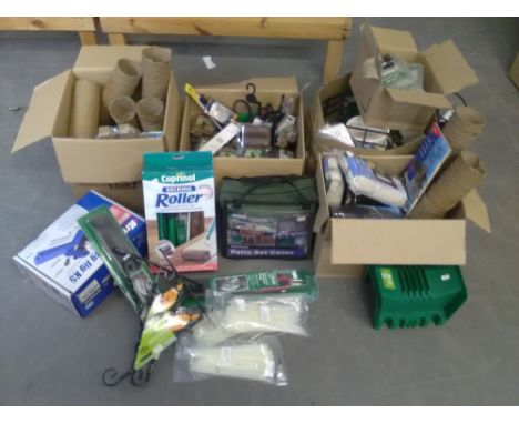 A quantity of garden items, including peat free growing pockets, fibre pots, decking roller, patio set cover, strimmer line a