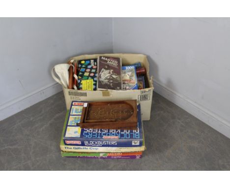 A small hardwood bagatelle board and a selection of various board games, blockbusters, Cluedo, The Gillette Cup, etc