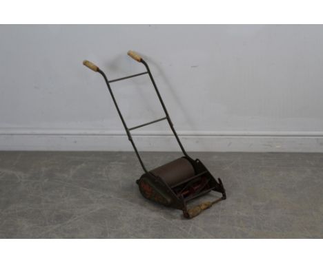 A vintage Webb 'Miniature' child's lawnmower, corrosion and paint losses, front roller AF, 53cm