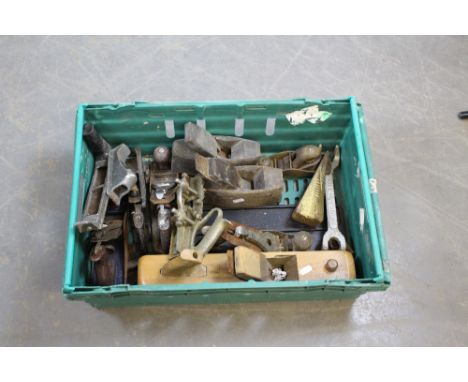 A box of various tools, block plane, metal woodworking planes, moulding plane, rasp, log splitting wedge etc
