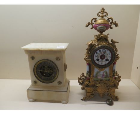 A white marble mantle clock with exposed escapement, 27cm tall x 20cm wide, not running, spring needs attention and an ormulu