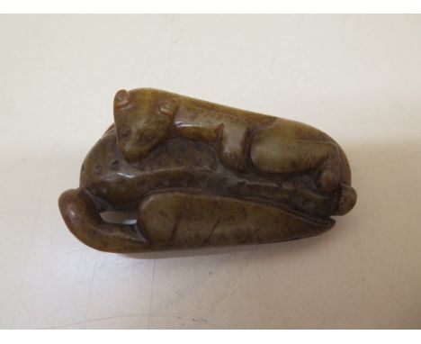 A Chinese 19th century jade carving of a tree squirrel, 7cm x 4cm, in good condition 