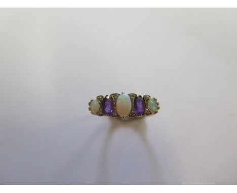 A hallmarked yellow gold opal, amethyst and diamond ring, size O, approx 2.6 grams in good condition 