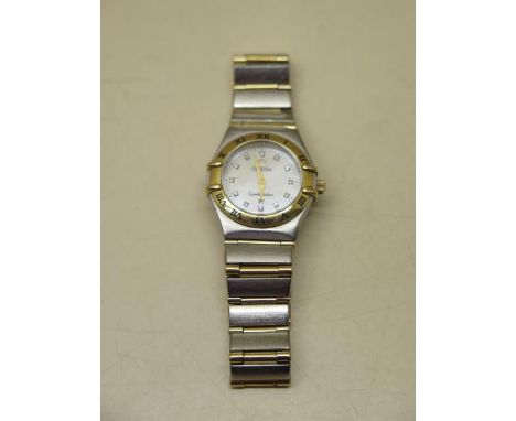 A ladies Omega constellation bi-metal quartz bracelet wristwatch with m,other of pearl dial and diamond markers, 22mm case, s