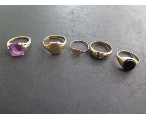 Four 9ct gold rings, one badly worn others some denting and wear, and a 14ct gold Amethyst ring, size O, 9ct approx 8.3 grams