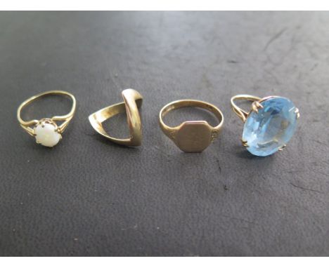 Four 9ct gold rings including a blue dress ring, size M, total weight approx 12 grams, all generally good 