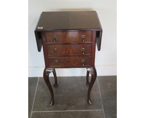 A walnut three drawer dropleaf sewing table, 75cm tall x 31cm x 70cm extended 