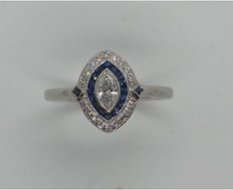 A platinum sapphire and marquis cut diamond ring, size approx N 1/2, head approx 12mm x 10mm, n good condition and diamonds b