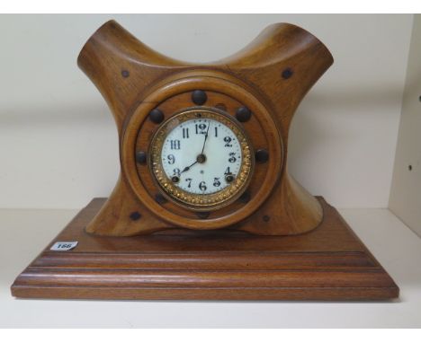 A propeller boss mantle clock with an Ansonia striking clock movement, 36cm tall x 49cm x 23cm, not currently running, strike