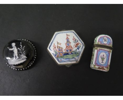 A Mary Gregory black glass trinket pill box, 5cm wide, in good condition, an enamel trinket/pill box and an enamel scent bott