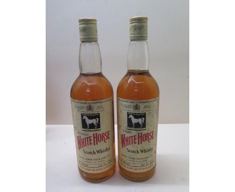 Two bottles of The White Horse cellar Scotch whisky 70% proof 26 2/3 floz bottle numbers 2008250 and 705451 Cannongate brewer