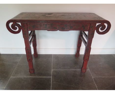 A Chinese 18th / 19th century lacquer altar table decorated with panels depicting scholars and landscapes surrounded by chrys