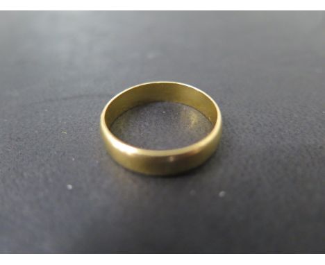 A 22ct yellow gold band ring, size N/O, approx 3.7 grams, some usage marks but generally good 