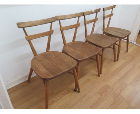 A set of four Ercol elm stacking children's chairs, 70cm tall, seat height 38cm, all are generally sturdy, all have some wear