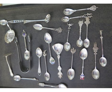A pair of silver nips and a collection of silver and white metal spoons and other flatware, total weight approx 9.5 troy oz 