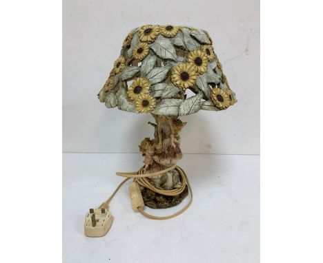 Ornate lamp shade with fairies and mushroom decoration to stem and sunflower decoration to the shade 