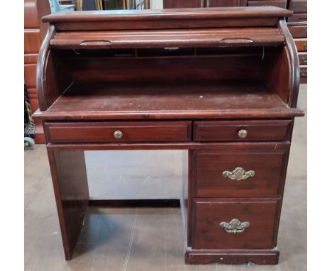 Vintage roll-top desk, roll-front reveals inner slope above four drawers 