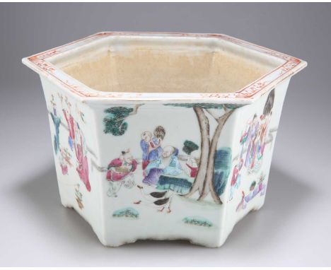 A CHINESE FAMILLE ROSE PLANTER, 18TH/19TH CENTURY hexagonal, enamel painted with figures. 28.5cm widehairline crack across th