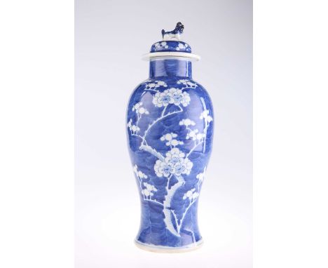 A CHINESE BLUE AND WHITE PORCELAIN PRUNUS PATTERN VASE AND COVER of baluster form, the domed cover (possibly associated) with