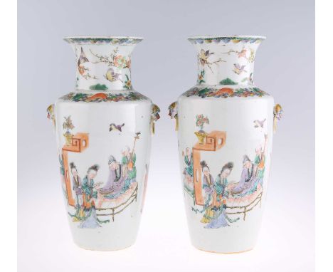 A PAIR OF CHINESE FAMILLE VERTE VASES of shouldered tapering form, enamel decorated with figures. (2) 22.5cm highEach with a 