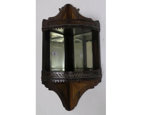 An Edwardian mahogany and satinwood inlay mirrored corner shelf with to fretwork galleried shelves, 63cm high Condition repor