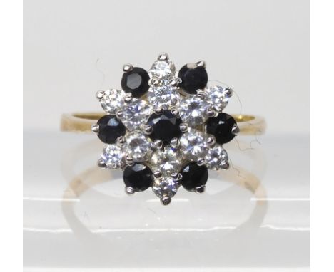 A 9ct gold sapphire and cz flower cluster ring, size O1/2, diameter 1.4cm, weight 3gms Light general wear