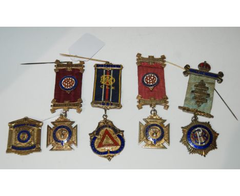 Five various silver-gilt and enamel Royal Order of Buffalo medallions, four with ribbon and bar (5) Condition report: Availab